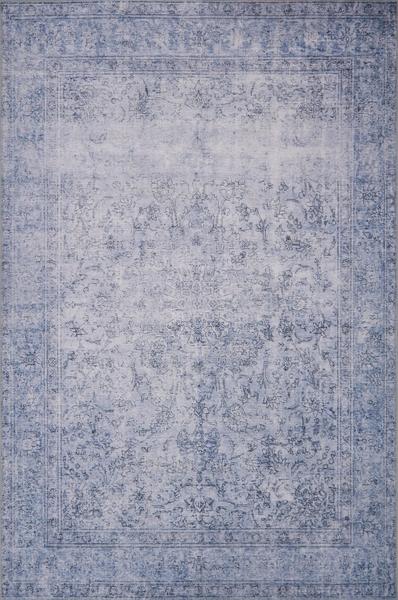 A faded blue and gray toned oriental area rug for the master bedroom from Loloi Rugs.