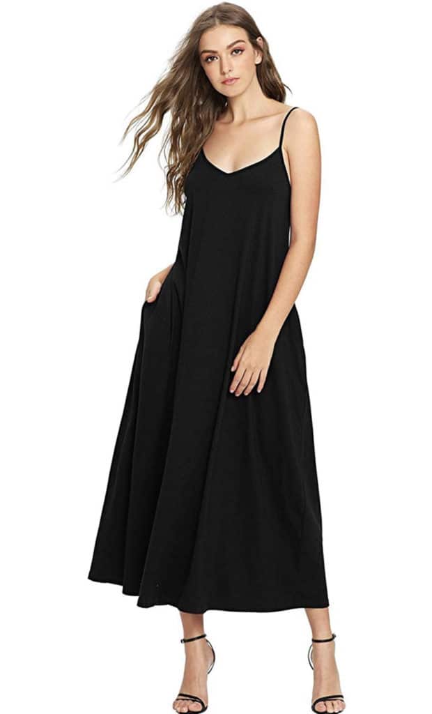 A model wearing a floor-length black spaghetti strap maxi dress with pockets.