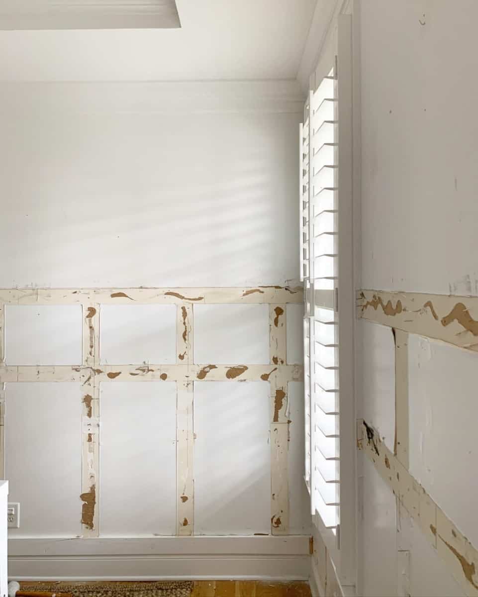 Surveying the wall damage caused by board and batten walls that were poorly installed in our home office. #office #kidsdesks #coastaldeco #coastalhome #builtins #builtindesks