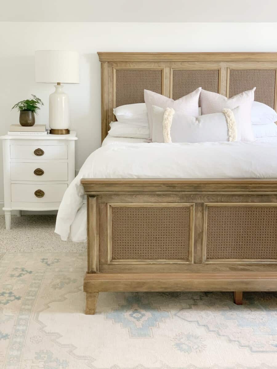Looking for white lamps for any decor style? Here's a round up of some of my favorite white lamps, like this one in our master bedroom - a simple white and gold ceramic lamp with a creme lamp shade. #whitelamp #designerlamp #tablelamp #coastaldecor #neutraldecor #livingroomdecor