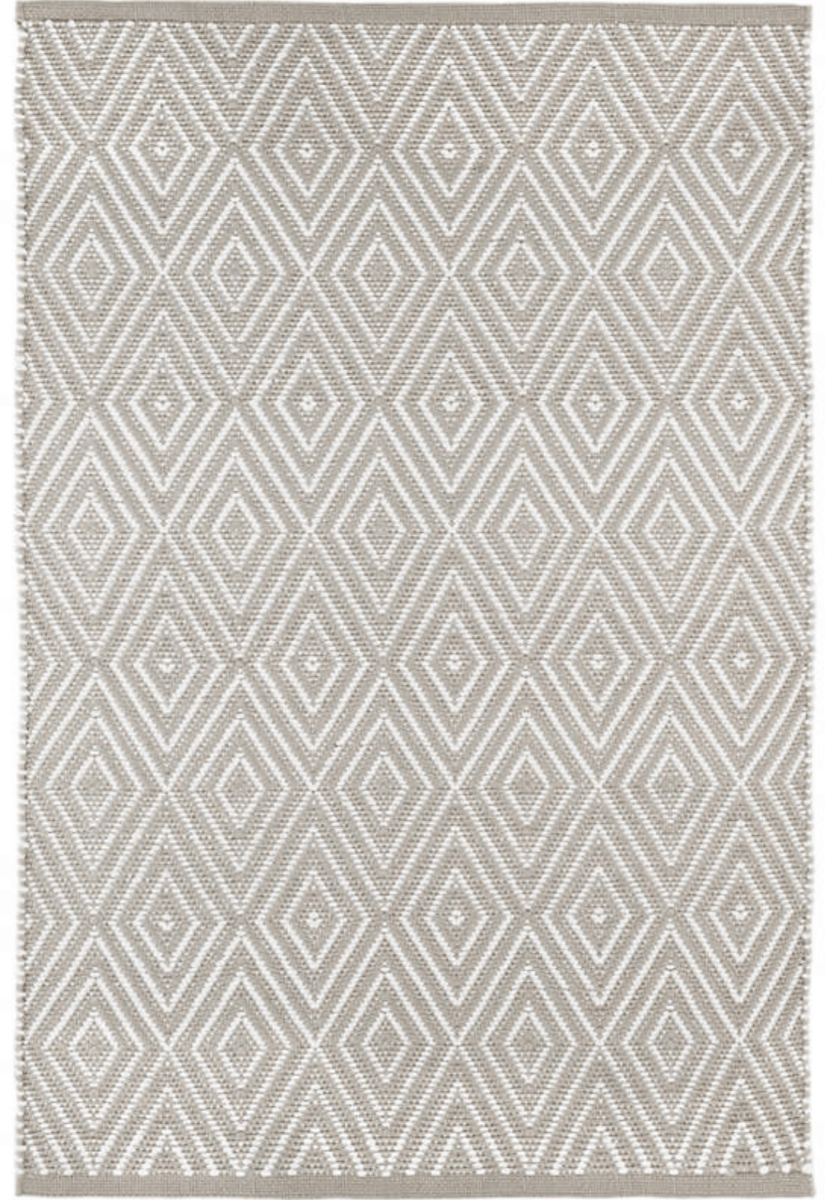 A gorgeous Dash & Albert rug in tab and white with geometric triangle patterns. This designer rug will look great in our coastal inspired living room.