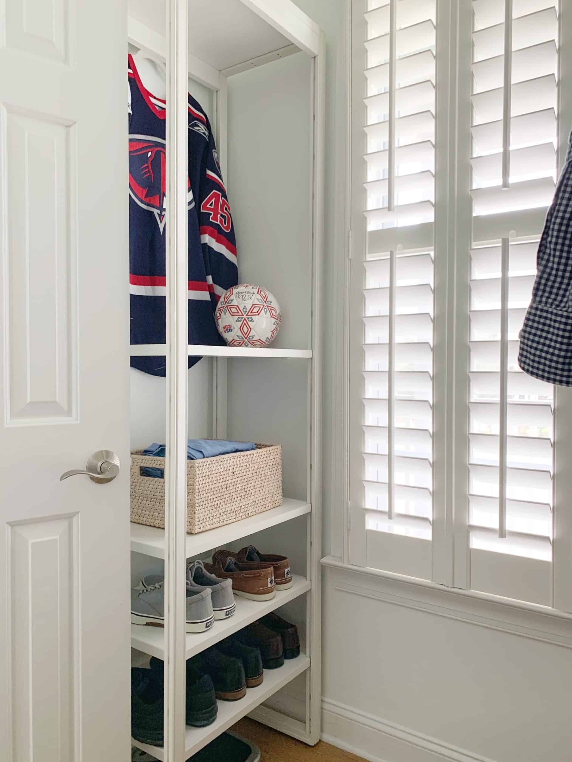 Our new closet organization storage comes with plenty of room to store and display important items, like a hockey jersey and soccer ball.