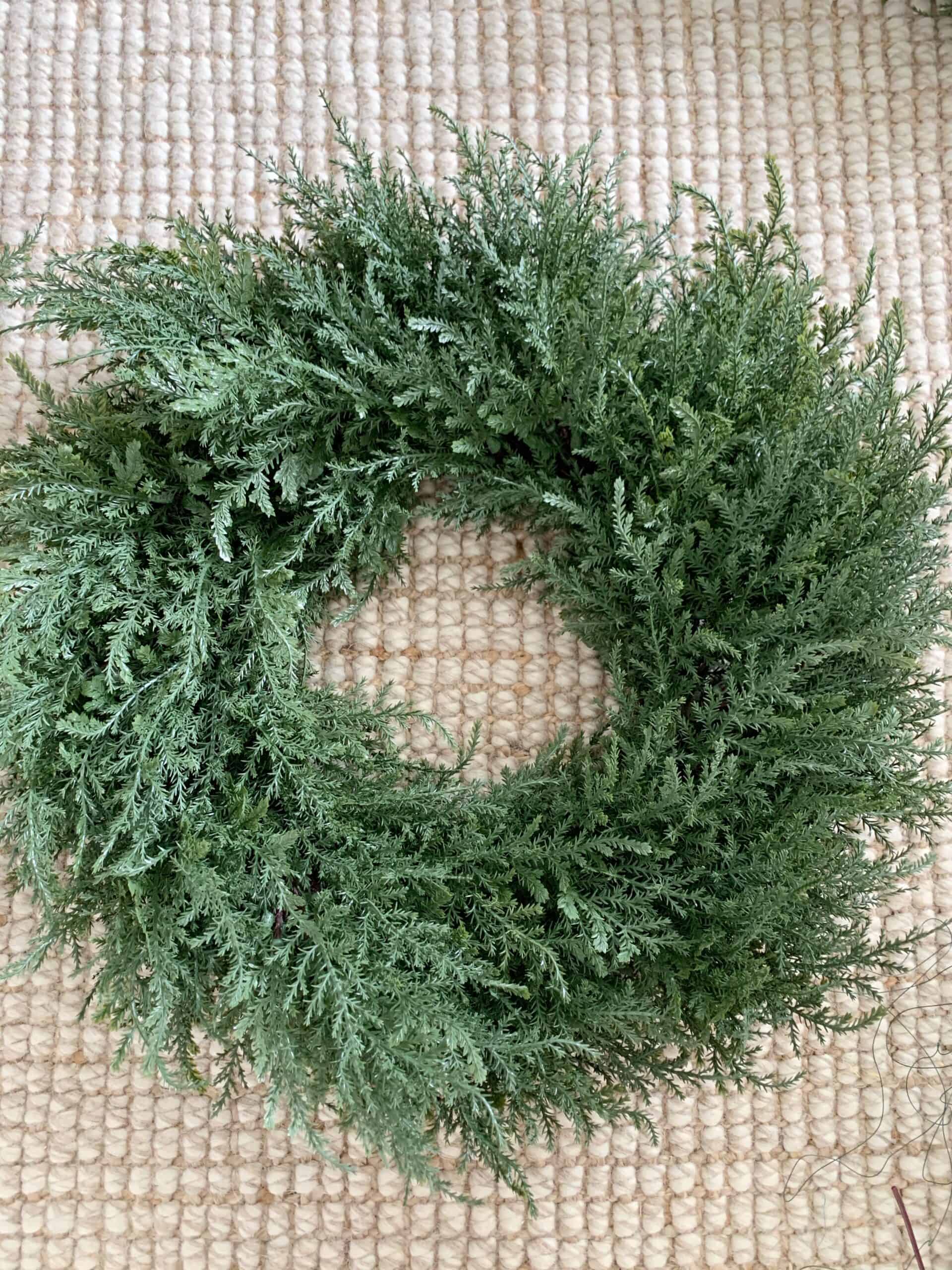 A plain, undecorated all natural cedar door wreath. #wreaths #winterwreath #neutralwreath #christmaswreath #fallwreath #falldecor #christmasdecor #christmas #neutralchristmasdecor #neutralfall