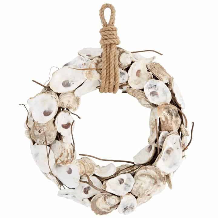 A unique oyster shell wreath hung with sailors rope