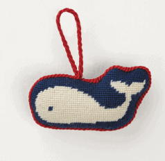 A cute white and navy blue cross stitch whale ornament.