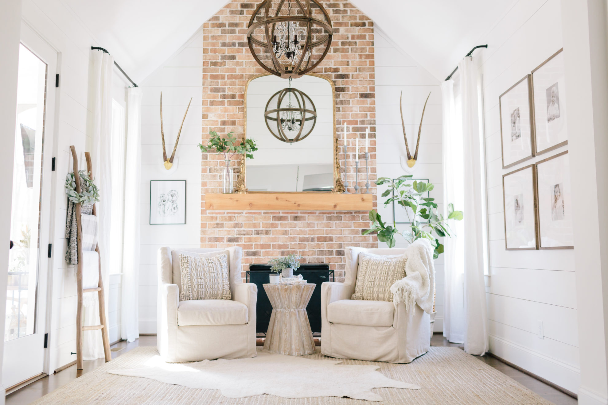 Extra white paint color used in a home with white shiplap and brick fireplace.