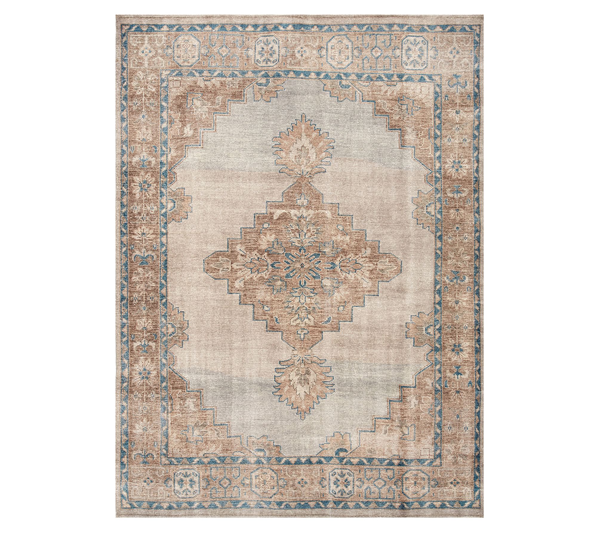 Handknotted rug with neutral and warm tones for living room.
