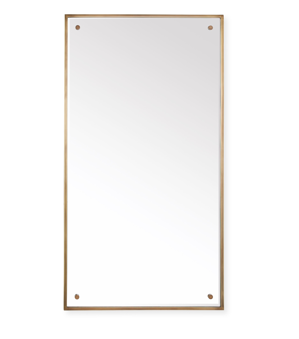 Tall narrow gold mirror in rectangular shape.