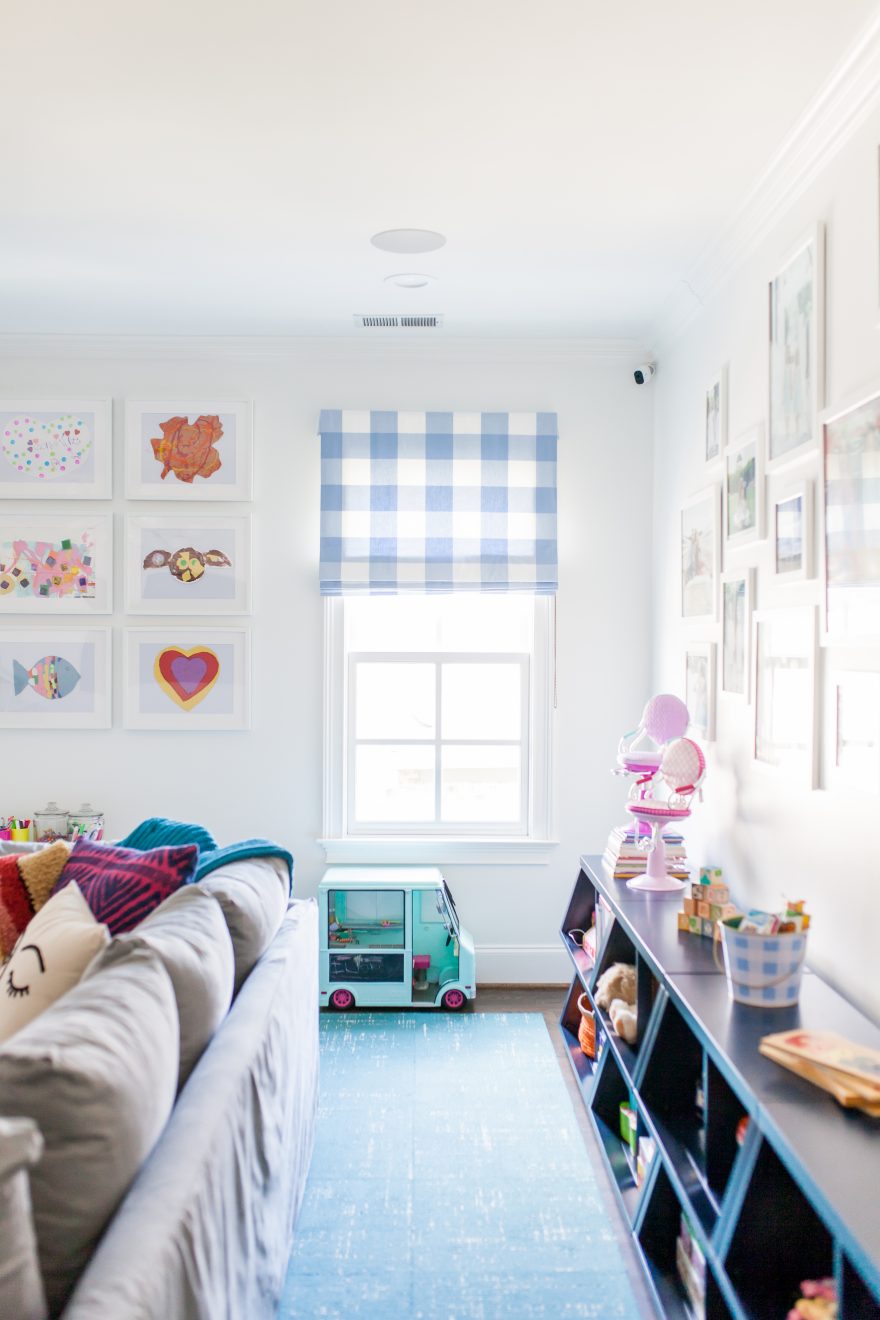 Bright blue toy storage for playroom design.