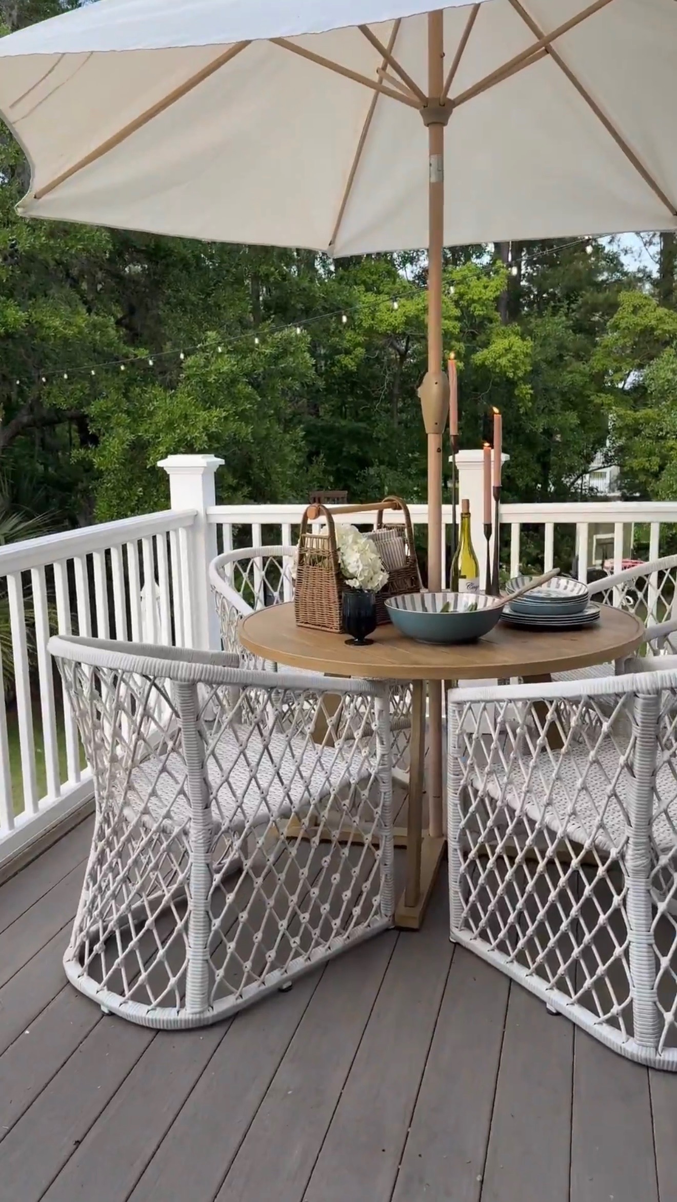 Back porch set up with coastal rattan outdoor dinnerware
