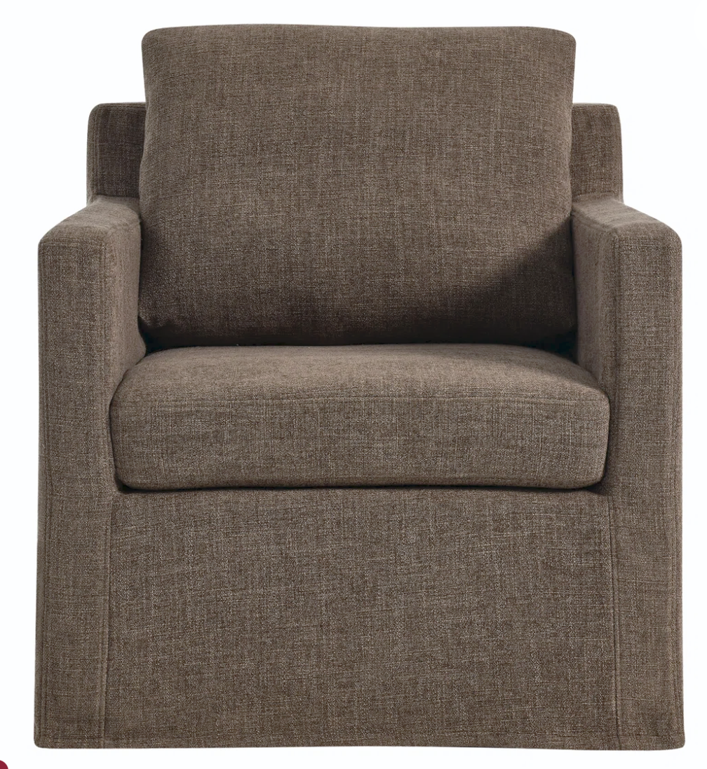 Brown slipcovered swivel chair